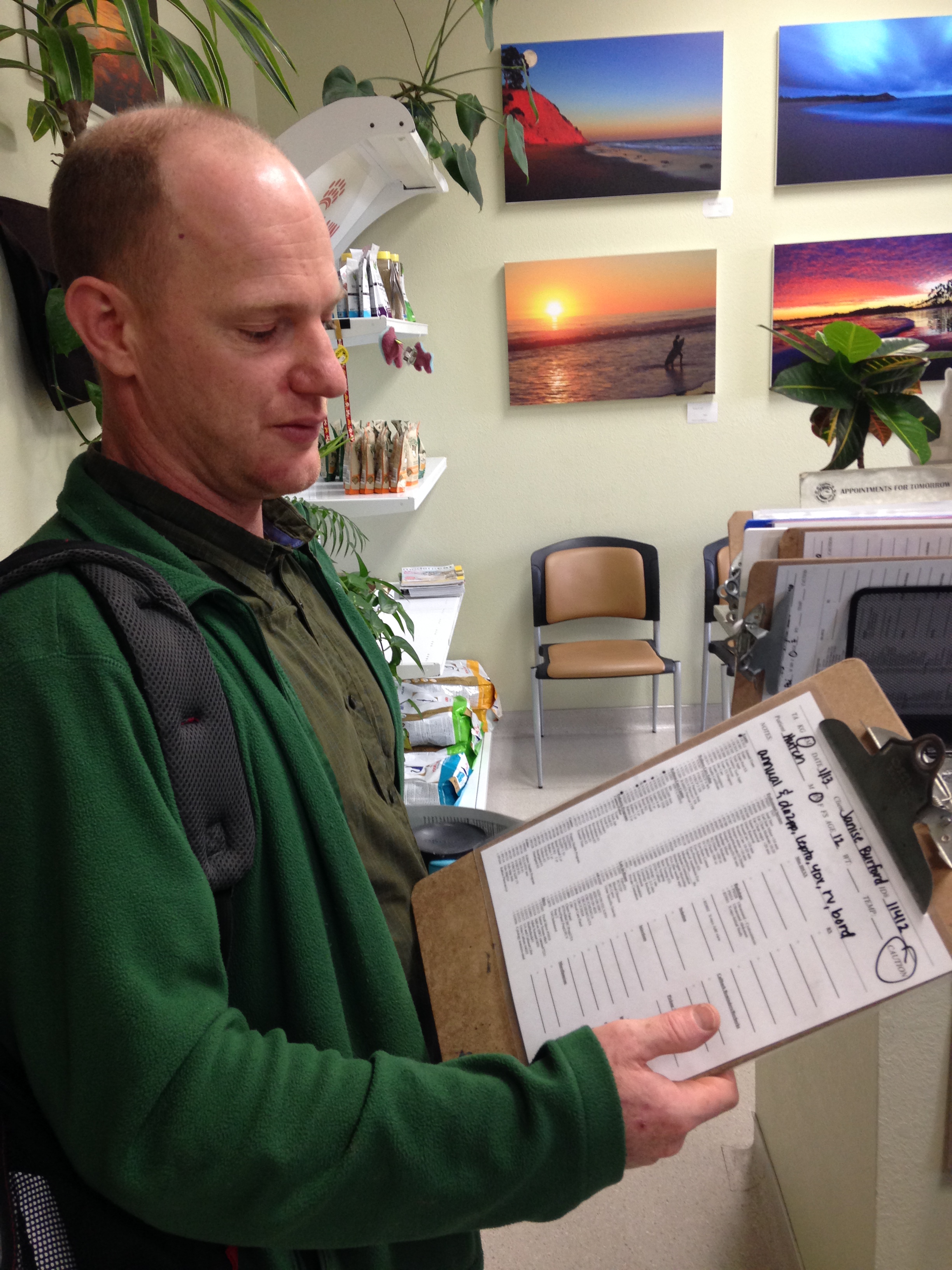 Dr. River May shows a veterinary chart in his office at the Capitola Veterinary Hospital.