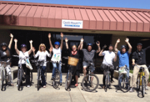 Bicyclists participating in Bike to Work Day pose for a photo.