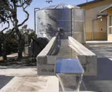 Image of a large metal rain cistern