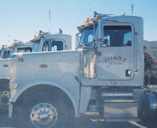 Image of a white semi truck with Chavez Truck on the side.